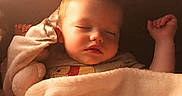 Alekzander is registered to the contest to win money with this photo: baby, sleeping, blanket, cozy, child, face, peaceful, soft, indoors, cute, rest, calm, infant, warm, comfort, portrait, toddler, relaxation, nap, bedtime