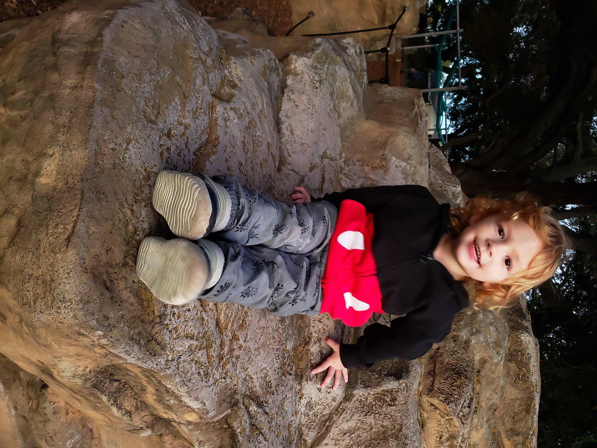 Khallin is registered to the contest to win money with this photo: adventure, archaeology, baby_toddler_clothing, bedrock, boot, child, erosion, fun, happy, joy, landscape, people_in_nature, person, recreation, rock, smile, soil, toddler, tree, trunk