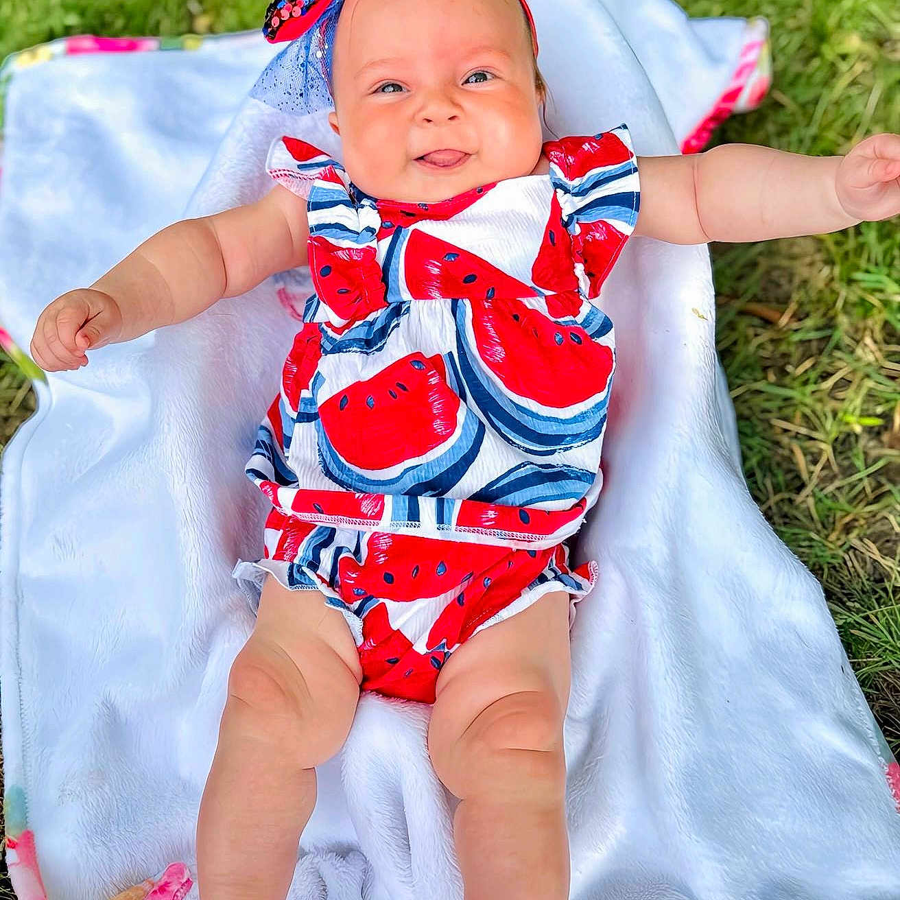 Alivia joined the competition — help win amazing prizes! baby, blanket, clothing, dress, face, grass, happy, hat, head, newborn, pants, person, photography, plant, portrait, quilt, sleeping, smile, t_shirt, towel