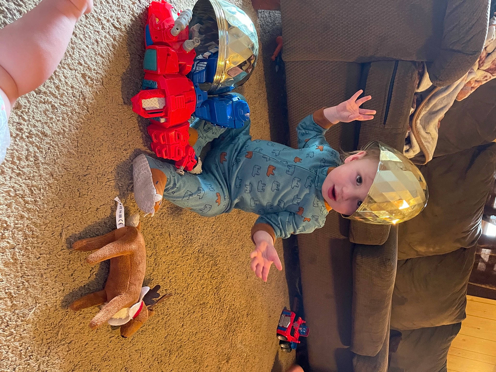 Lincoln is registered to the contest to win money with this photo: adventure, animation, carmine, child, costume, event, fictional_character, flooring, fun, hat, headwear, leisure, person, plastic, play, recreation, room, smile, sun_hat, toddler