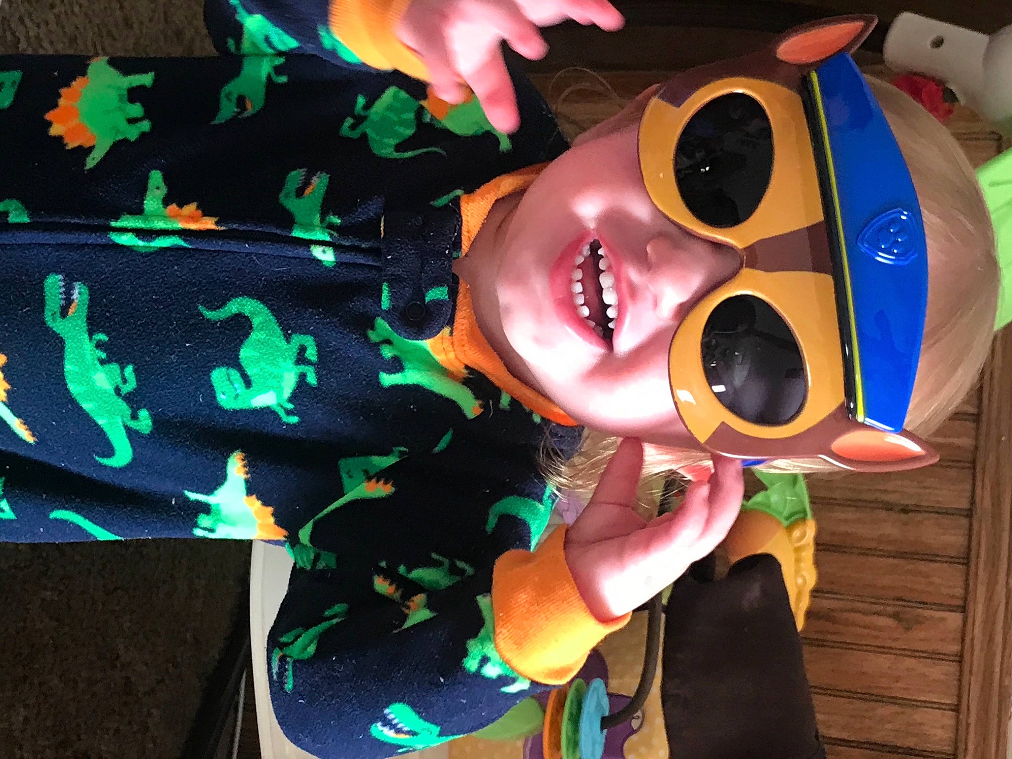 Lincoln is registered to the contest to win money with this photo: animation, art, child, event, eyewear, fun, goggles, happy, headwear, light, organism, person, personal_protective_equipment, smile, sunglasses, toy, vision_care