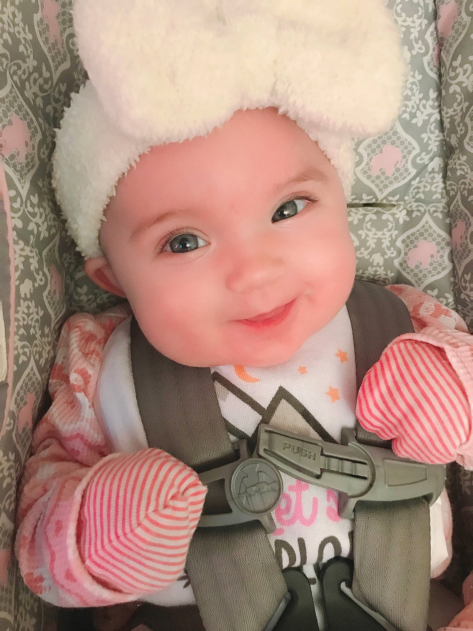 Leelya is registered to the contest to win money with this photo: baby, baby_toddler_clothing, cap, cheek, child, costume_hat, face, facial_expression, happy, hat, head, headgear, headwear, pattern, person, pink, skin, sleeve, smile, textile