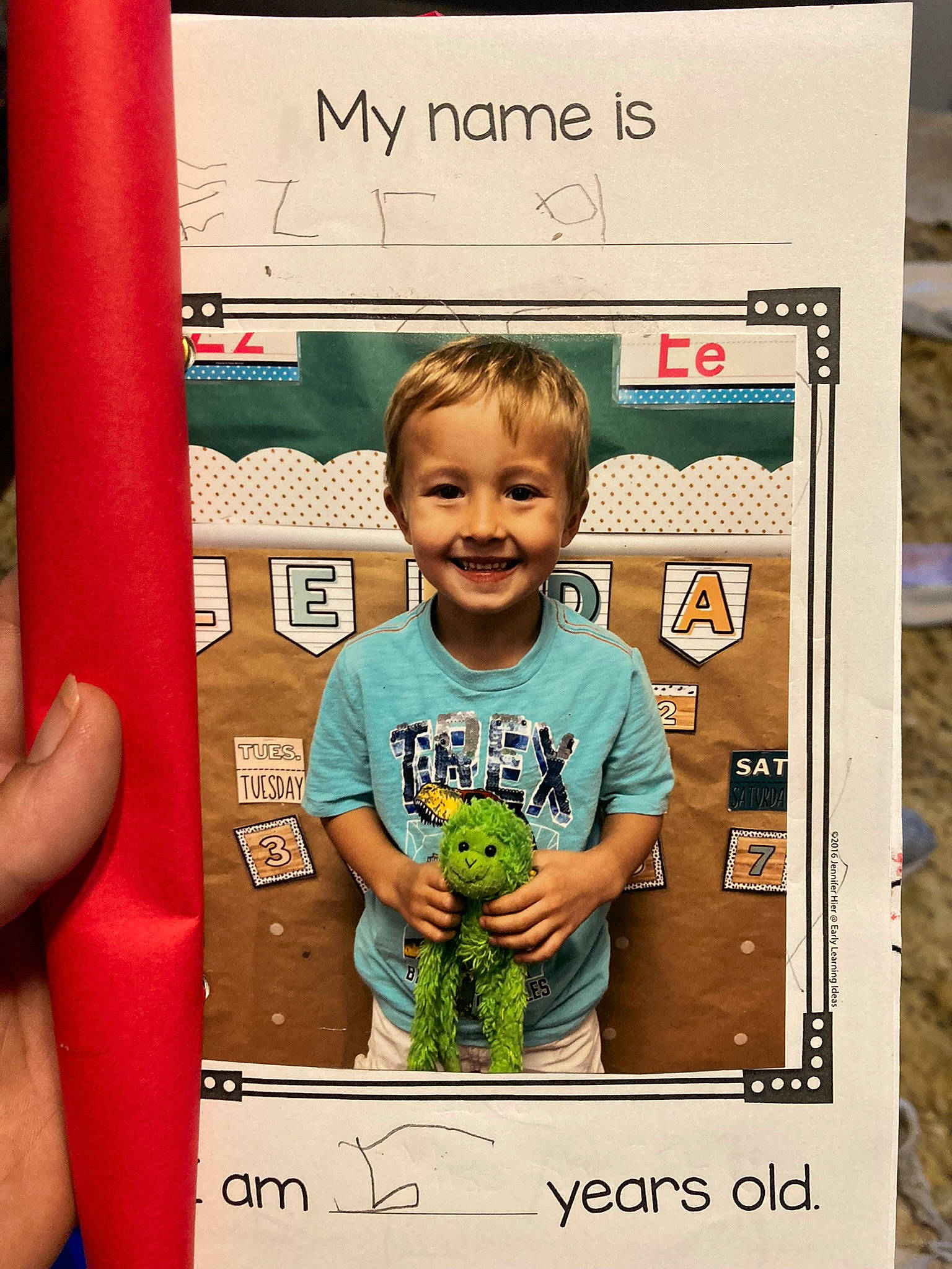 Ezra is registered to the contest to win money with this photo: baby, baby_toddler_clothing, child, facial_expression, font, gesture, handwriting, happy, joy, magenta, pattern, person, product, room, sleeve, smile, t_shirt, thumb, toddler, visual_arts