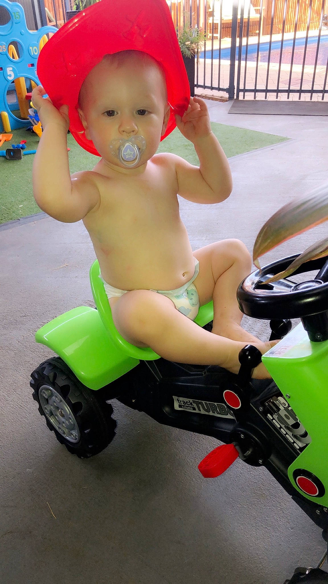 Levii is registered to the contest to win money with this photo: car, child, person, play, riding_toy, toddler, toy, tricycle, vehicle