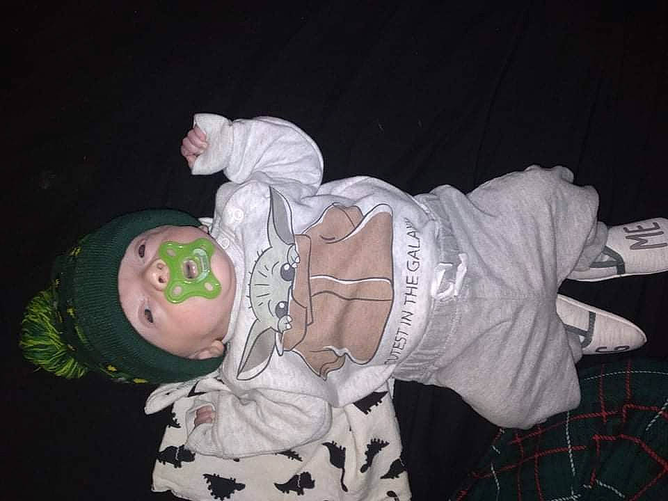 Mavrick is registered to the contest to win money with this photo: baby, baby_toddler_clothing, black, child, costume, event, fun, hat, lap, pattern, person, plaid, sleeve, tartan, textile, toddler, white