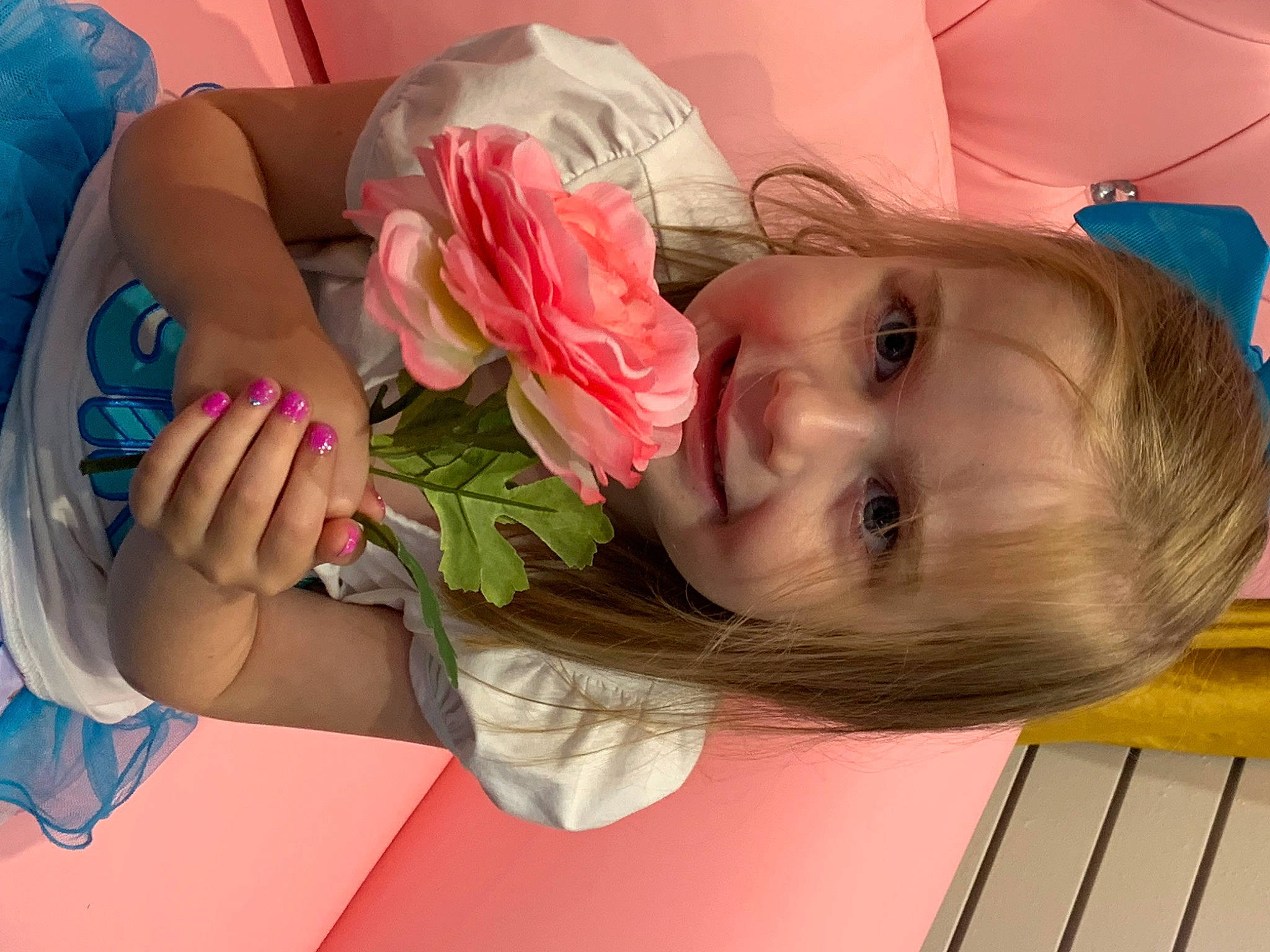 Liberty is registered to the contest to win money with this photo: baby_toddler_clothing, beauty, child, dress, eye, face, finger, flower, fun, gesture, hand, happy, hat, joy, person, petal, pink, plant, rose, skin