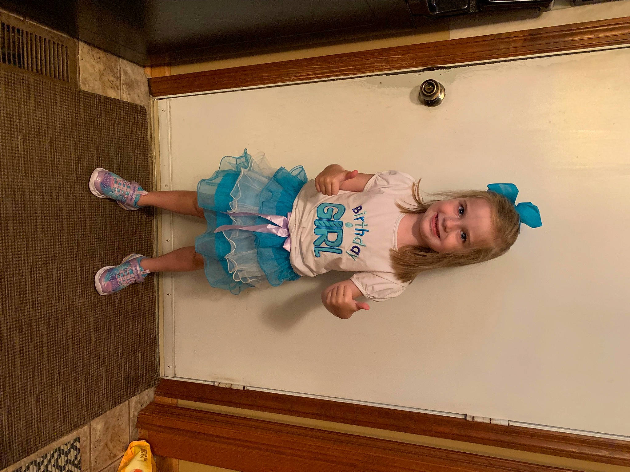 Liberty is registered to the contest to win money with this photo: baby, baby_toddler_clothing, child, floor, flooring, fun, happy, hardwood, human_leg, joy, person, room, sleeve, smile, sock, t_shirt, thigh, toddler, vacation, wood