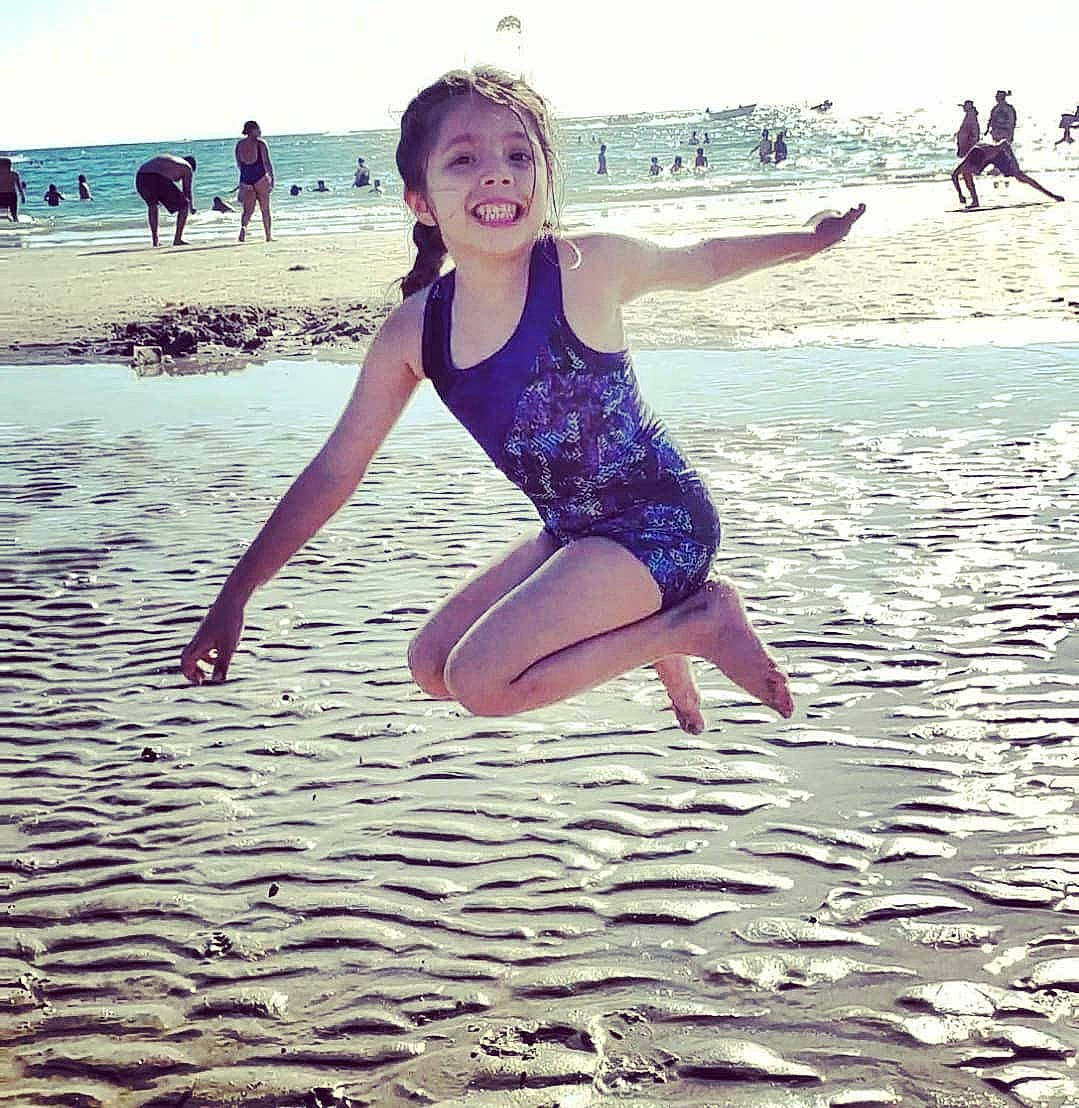 Nadine is registered to the contest to win money with this photo: barefoot, beach, flash_photography, fun, happy, horizon, joy, leg, leisure, people_in_nature, people_on_beach, person, physical_fitness, recreation, shore, smile, sportswear, swimwear, thigh, waist