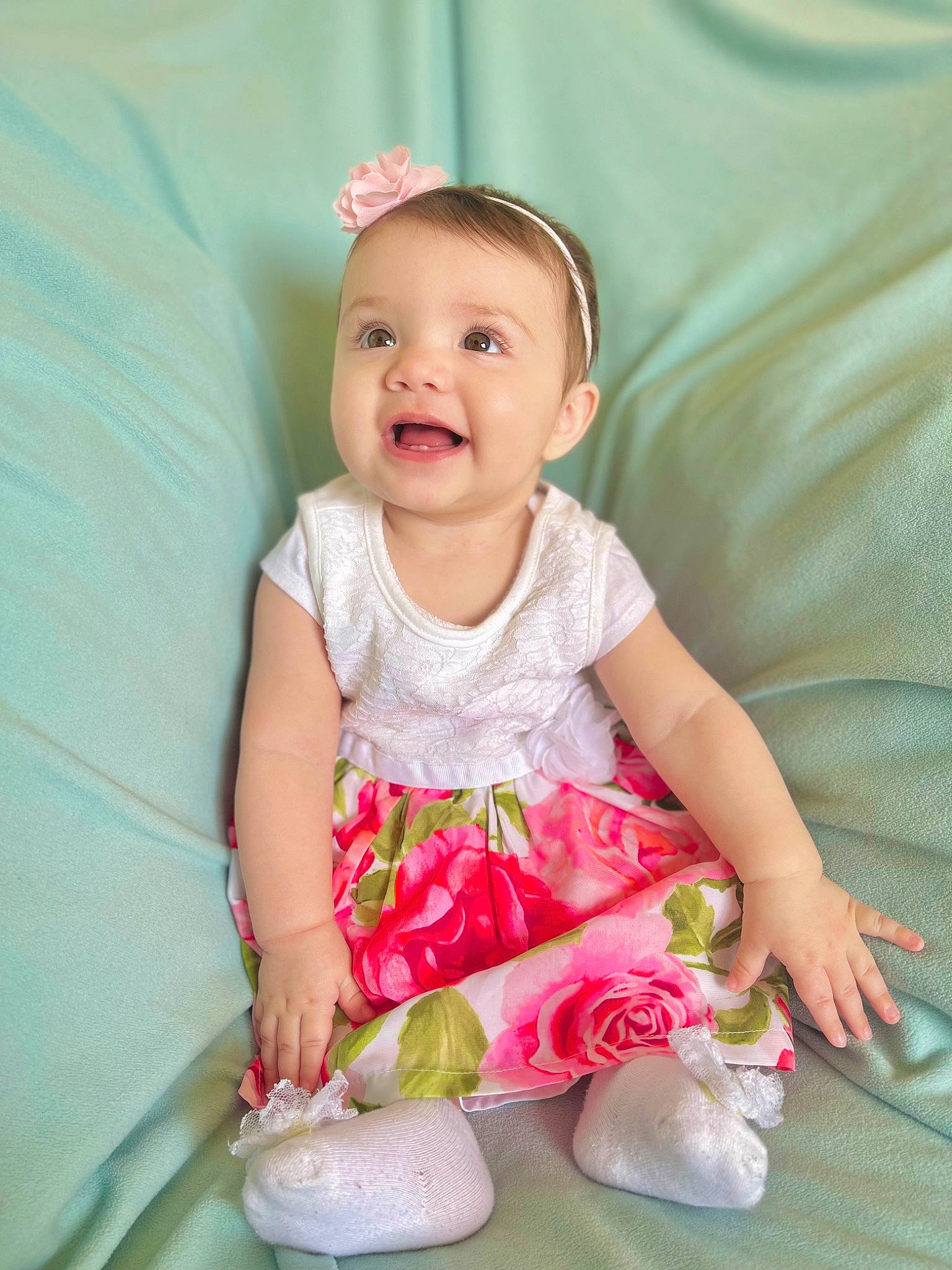 Celeste is registered to the contest to win money with this photo: baby, baby_toddler_clothing, child, comfort, day_dress, dress, finger, fun, grass, happy, magenta, pattern, person, pink, product, sitting, skin, sleeve, smile, textile