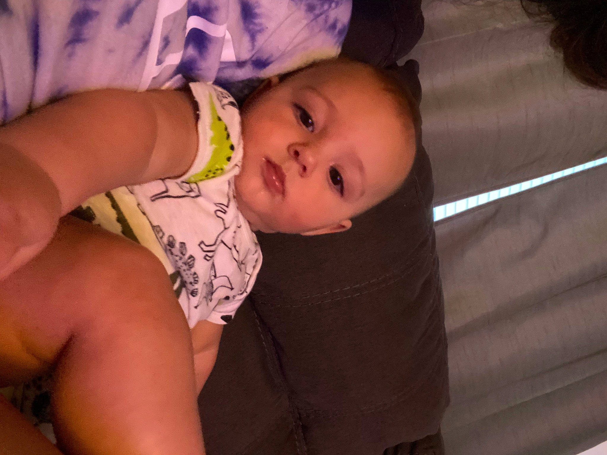 Makai is registered to the contest to win money with this photo: baby, baby_toddler_clothing, cheek, comfort, eye, face, finger, flash_photography, hand, happy, human_body, iris, lip, mouth, nose, person, purple, skin, thigh, toddler