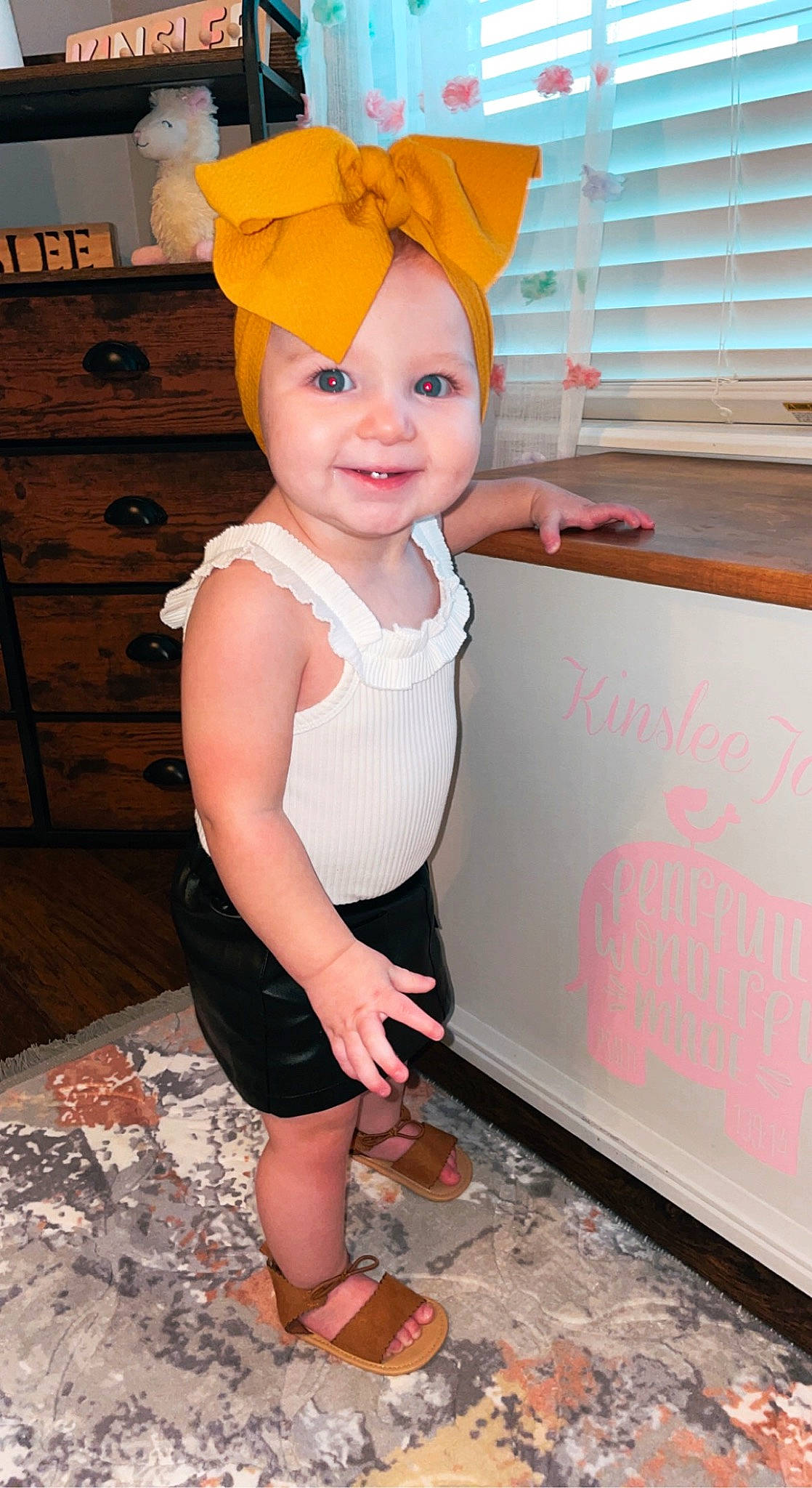 Kinslee joined the competition — help win amazing prizes! baby_toddler_clothing, cabinetry, cap, costume_hat, eye, face, floor, flooring, fun, happy, hat, headgear, headwear, joy, person, pink, sleeve, smile, standing, thigh