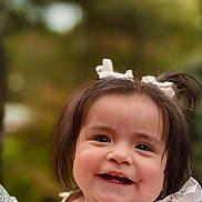 Sol is registered to the contest to win money with this photo: toddler, child, smiling, happy, outdoor, portrait, face, hair_bow, dress, ruffles, baby, cute, skin, person, young_child, nature, daylight, closeup, cheerful, expression