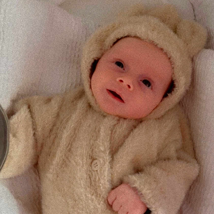 Kéanu joined the competition — help win amazing prizes! baby, blanket, buttoned_jacket, child, comfort, cozy, cute, ears, face, fuzzy, hands, hood, indoors, infant, lying_down, newborn, portrait, sleeping_area, soft, warm_clothing