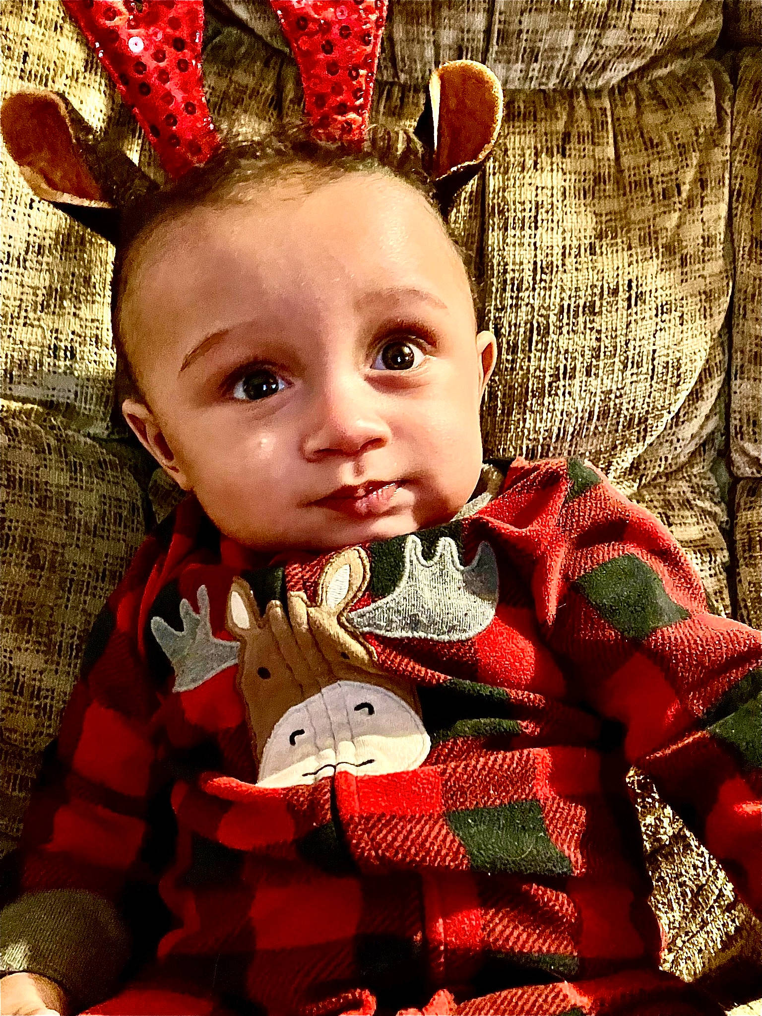 Joziah is registered to the contest to win money with this photo: baby, baby_toddler_clothing, beauty, cheek, christmas, christmas_ornament, costume_hat, event, fawn, grass, happy, head, holiday, holiday_ornament, human_body, ornament, person, red, sleeve, textile