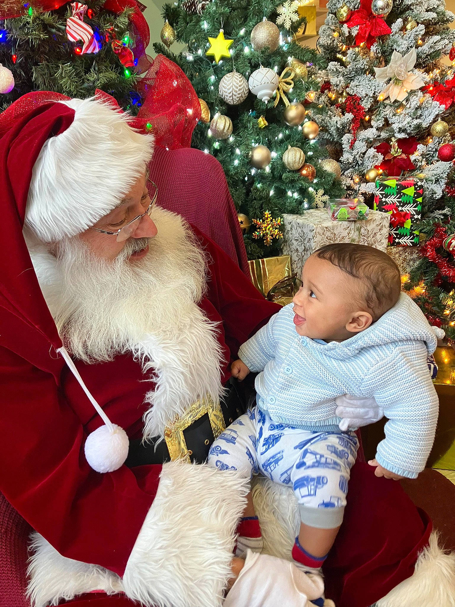 Joziah joined the competition — help win amazing prizes! beard, christmas, christmas_eve, christmas_ornament, christmas_tree, event, face, hair, happy, hat, head, holiday, human_body, lap, people_in_nature, person, photograph, red, santa_claus, toddler