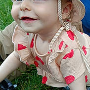 Meriem participe au concours pour gagner de l'argent avec cette photo : baby, child, smiling, hat, striped_hat, outdoor, grass, cute, happy, crawling, infant, red_hearts, clothing, sun_hat, nature, face, young_child, person, cheerful, daylight