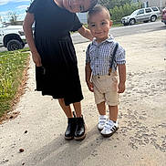 Mateo joined the competition — help win amazing prizes! children, smiling, outdoor, sidewalk, black_dress, shorts, suspenders, sneakers, boots, grass, cars, houses, mountains, daylight, happy, siblings, person, portrait, nature, playful