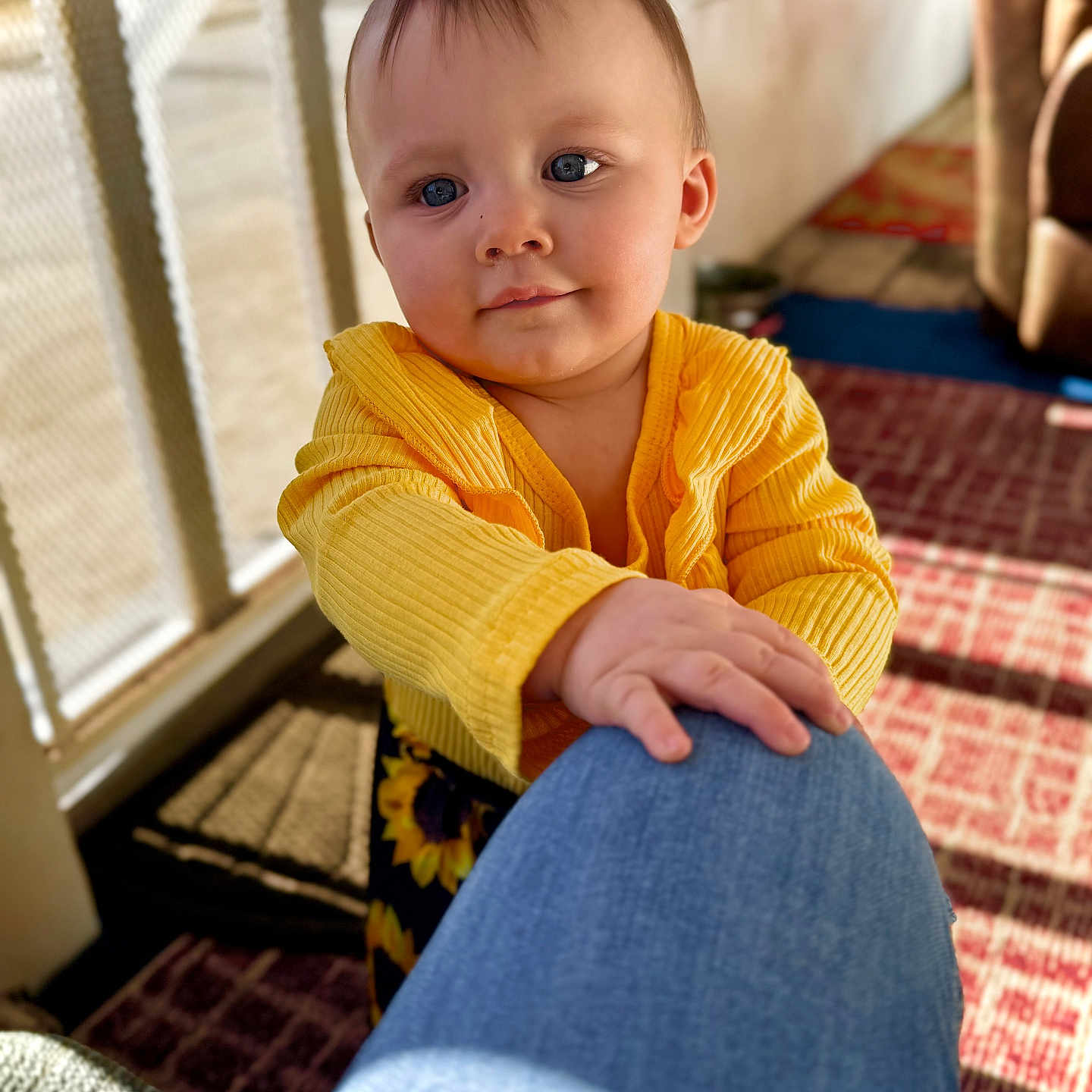 Waverley joined the competition — help win amazing prizes! baby, blue_jeans, carpet, casual, child, couch, curious, face, floor, hand, home, indoor, infant, person, portrait, sunlight, touch, warm_light, window, yellow_clothing