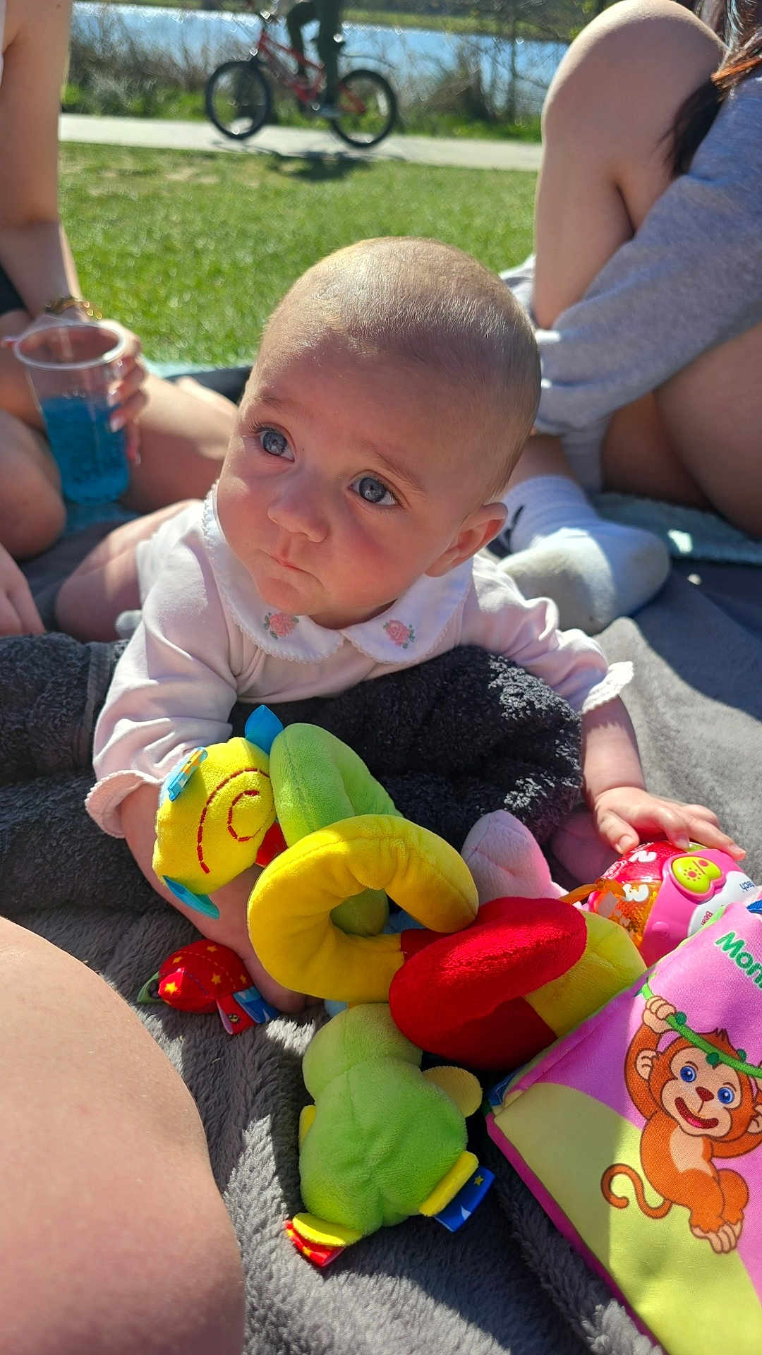 Mia-Mae joined the competition — help win amazing prizes! baby, bicycle, blanket, blue_eyes, casual, child, colorful, cute, grass, outdoor, park, people, person, play, plush_toy, relax, soft_toys, summer, sunlight, toy