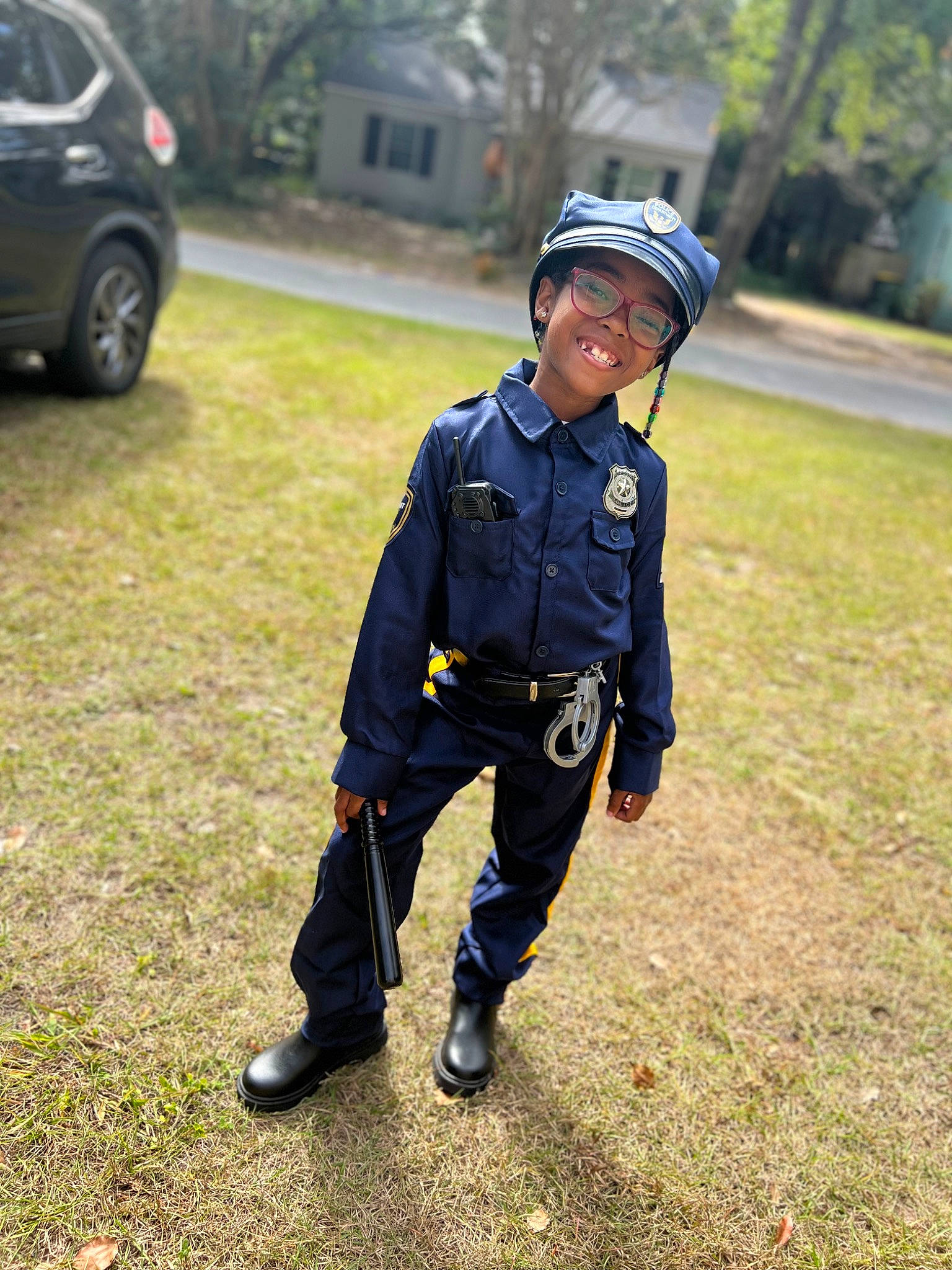 Malaya is registered to the contest to win money with this photo: automotive_tire, bicycle_helmet, bicycles_equipment_and_supplies, car, electric_blue, grass, headwear, helmet, joy, person, personal_protective_equipment, plant, recreation, security, sports_equipment, sports_gear, tire, toddler, tree, uniform