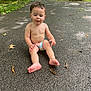 Porter joined the competition — help win amazing prizes! toddler, child, barefoot, diaper, outdoor, driveway, wet_surface, dirt, leaves, trees, grass, garage, vehicle, summer, curious, sitting, nature, daylight, casual, exploration