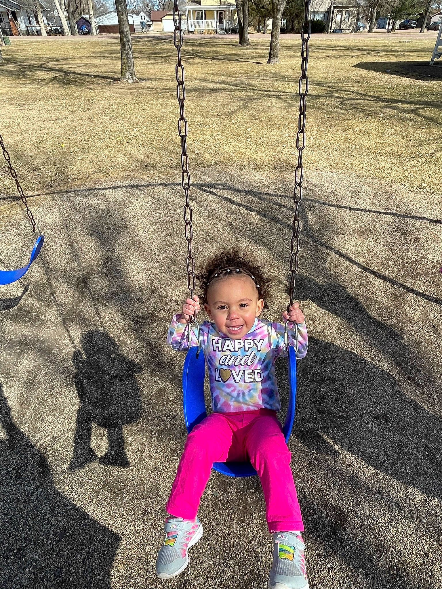 Ryleigh joined the competition — help win amazing prizes! baby, baby_toddler_clothing, child, city, fun, grass, happy, joy, leisure, mammal, people_in_nature, person, plant, playground, public_space, recreation, smile, snapshot, swing, toddler