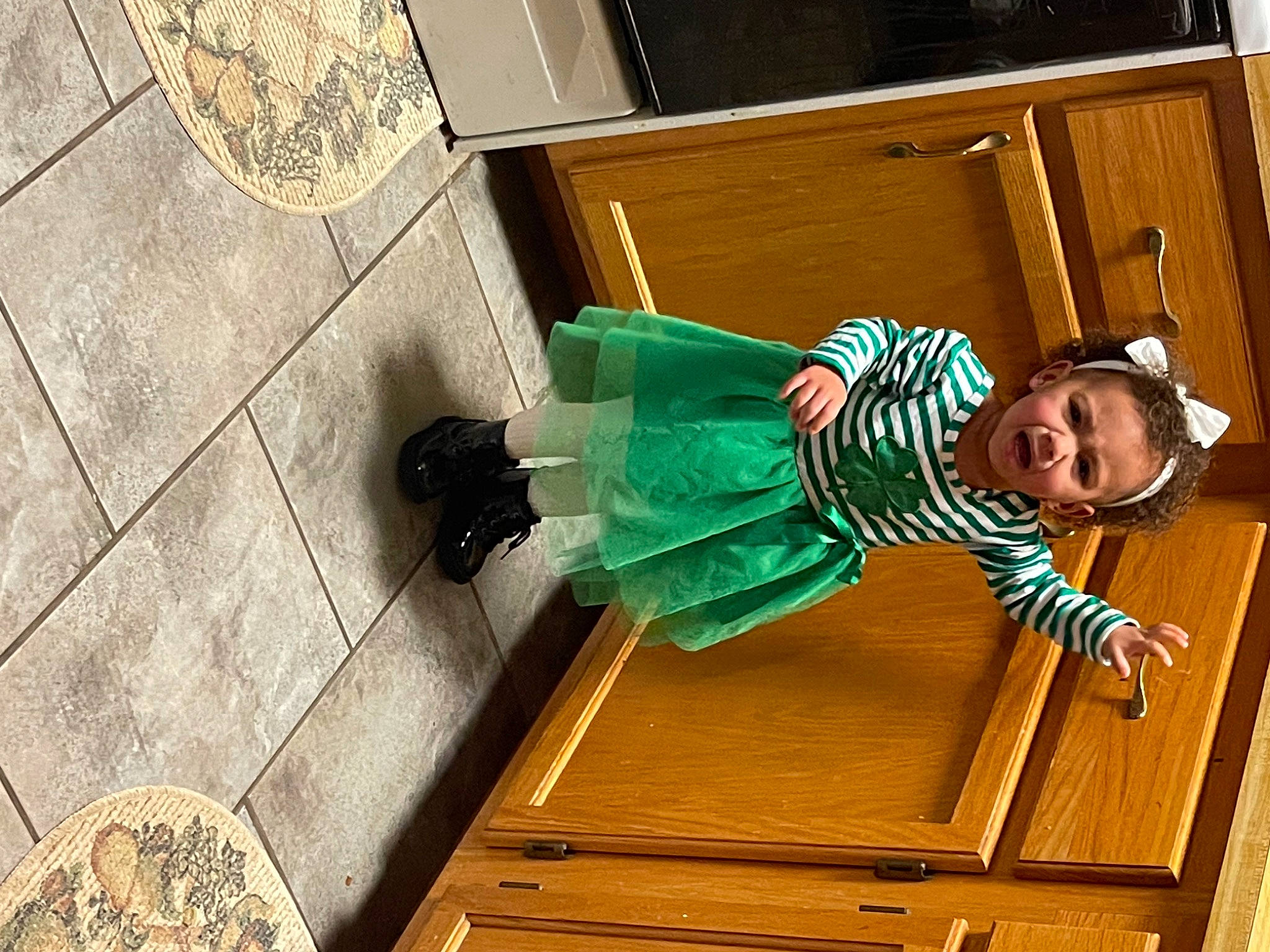 Ryleigh is registered to the contest to win money with this photo: baby, baby_toddler_clothing, concrete, door, floor, flooring, fun, happy, hardwood, person, road_surface, room, sidewalk, sitting, smile, sorrow, street_fashion, sunglasses, toddler, varnish