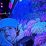 baby, child, hat, aquarium, coral, underwater, colorful, purple_light, blue_light, face, person, curious, indoor, glow, closeup, hand, carrier, soft_light, marine_life, exploration