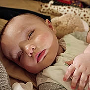 Kyleigh is registered to the contest to win money with this photo: baby, sleeping, pacifier, blanket, plush_toy, clothing, hand, face, closeup, indoor, cozy, child, rest, soft, infant, peaceful, cute, nap, comfort, skin