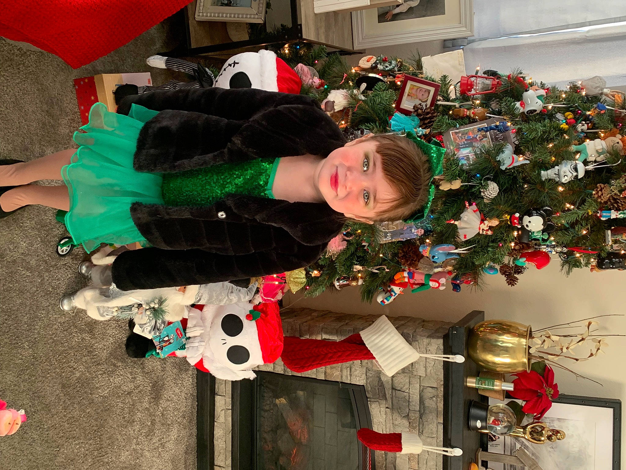 Tiffany is registered to the contest to win money with this photo: balloon, carmine, christmas, christmas_decoration, christmas_eve, christmas_ornament, christmas_tree, conifer, event, fictional_character, fun, holiday, holiday_ornament, interior_design, joy, lap, ornament, person, plant, red