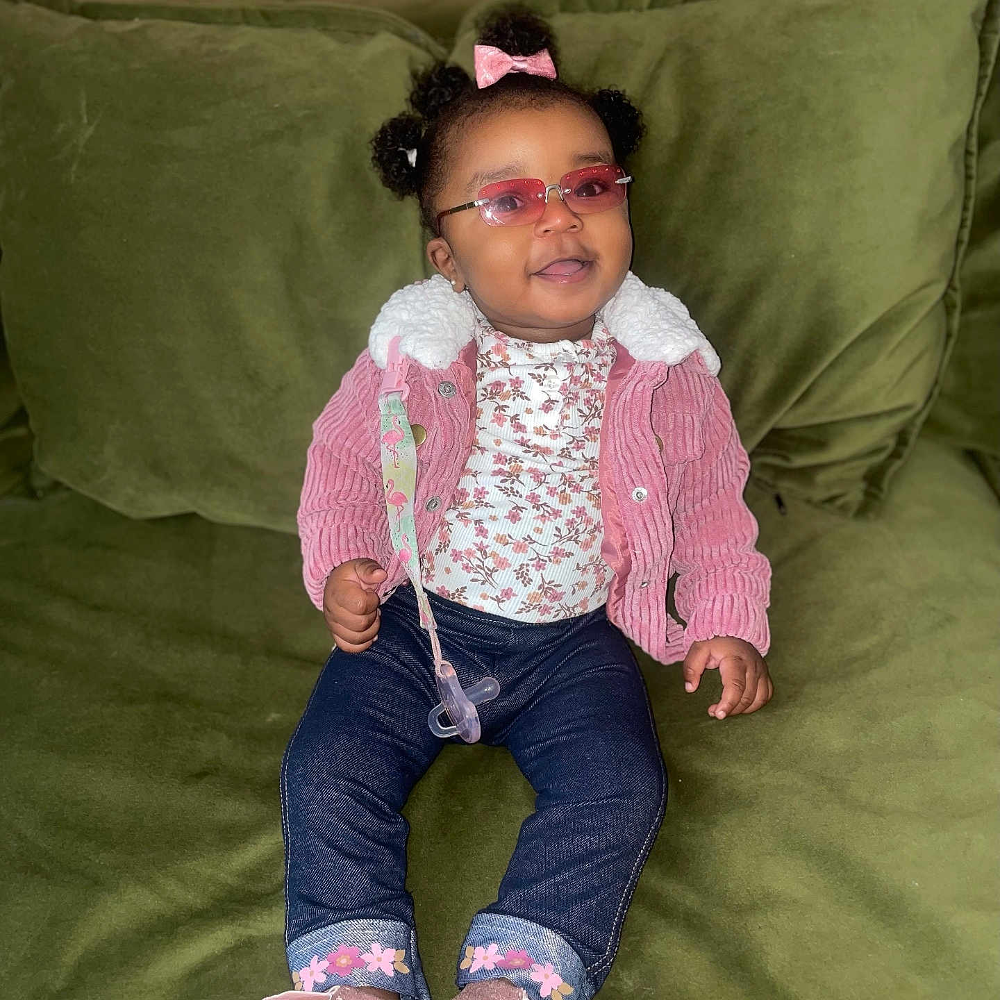 Britney is registered to the contest to win money with this photo: accessories, blackhair, child, clothing, couch, curlyhair, cushion, face, female, footwear, furniture, girl, glasses, hair, happy, head, homedecor, jeans, jewelry, necklace