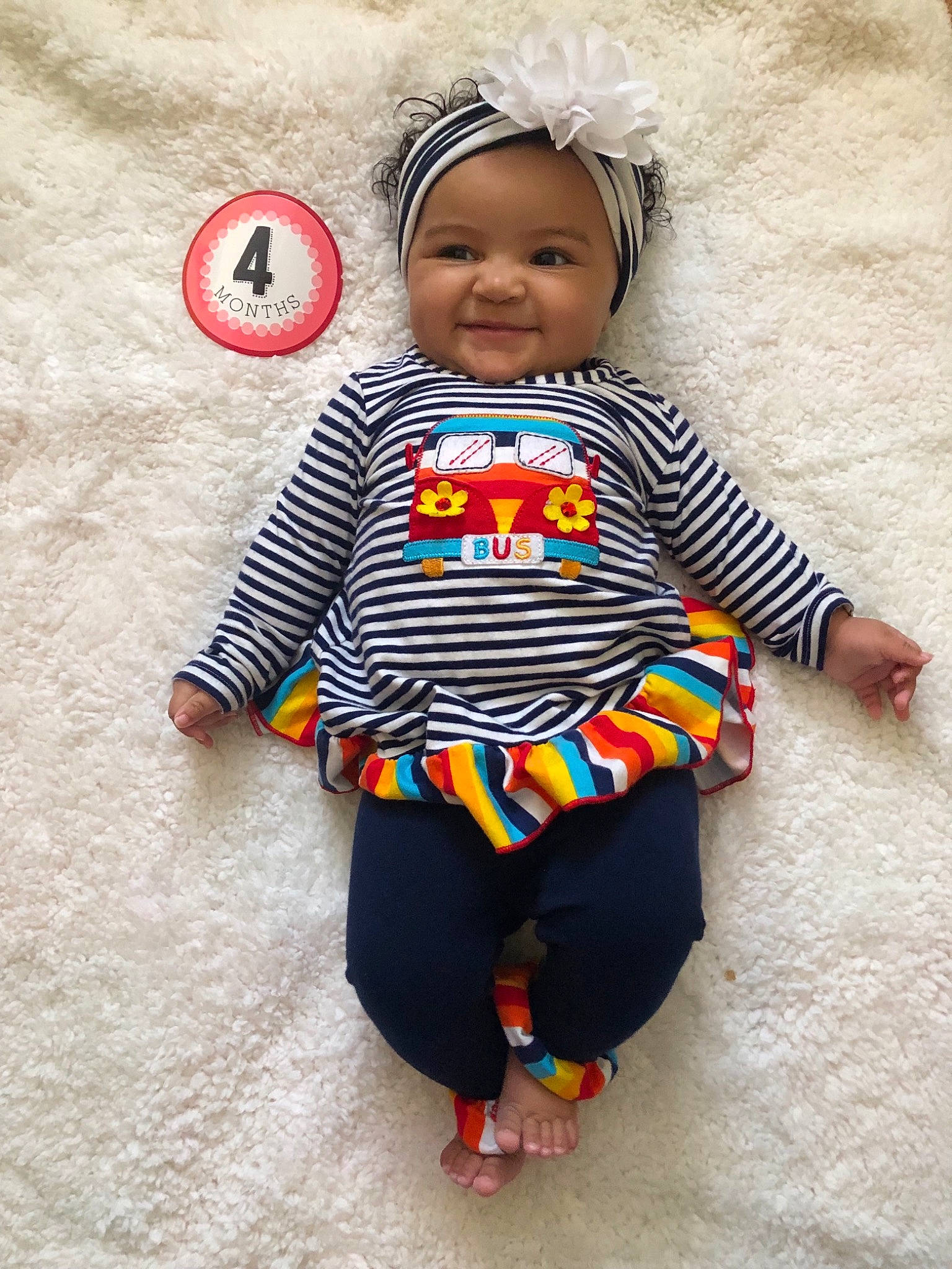 Palmer is registered to the contest to win money with this photo: baby, baby_products, baby_toddler_clothing, child, clothing, hair_accessory, head, joy, outerwear, pattern, people, person, play, skin, sleeve, smile, textile, toddler, yellow