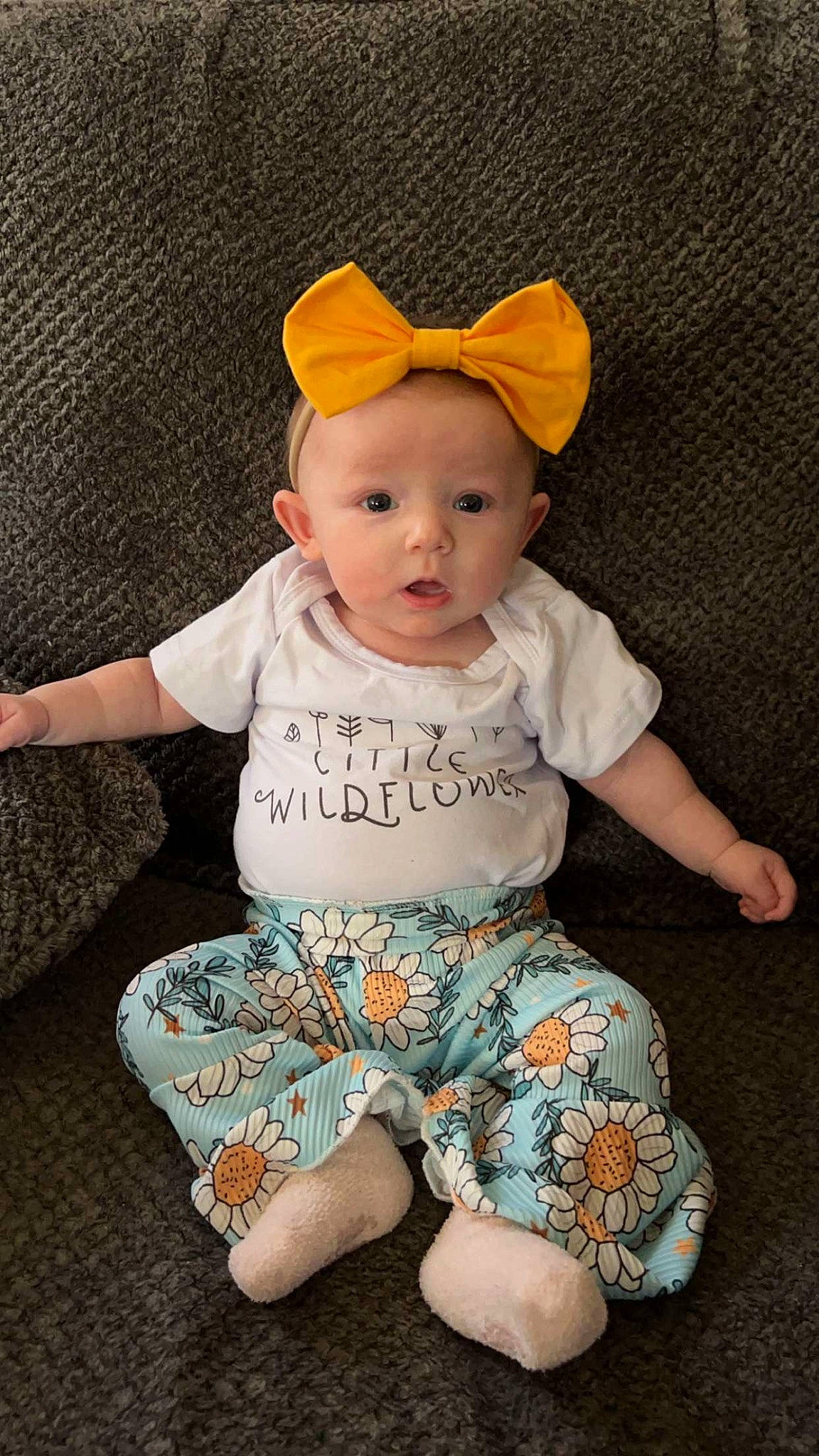 Emberlynn joined the competition — help win amazing prizes! baby, baby_products, baby_toddler_clothing, cap, cheek, child, comfort, costume_hat, happy, head, linens, pattern, person, pink, sitting, skin, sleeve, surprise, t_shirt, textile