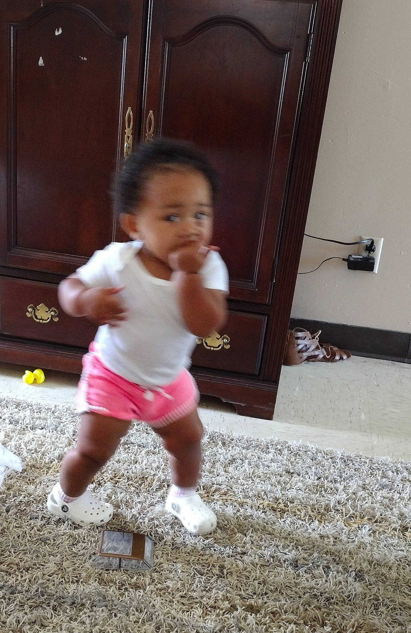 Dallas is registered to the contest to win money with this photo: baby, baby_toddler_clothing, child, door, flooring, foot, fun, happy, hardwood, home_door, human_leg, person, play, sleeve, smile, standing, t_shirt, thigh, thumb, toddler