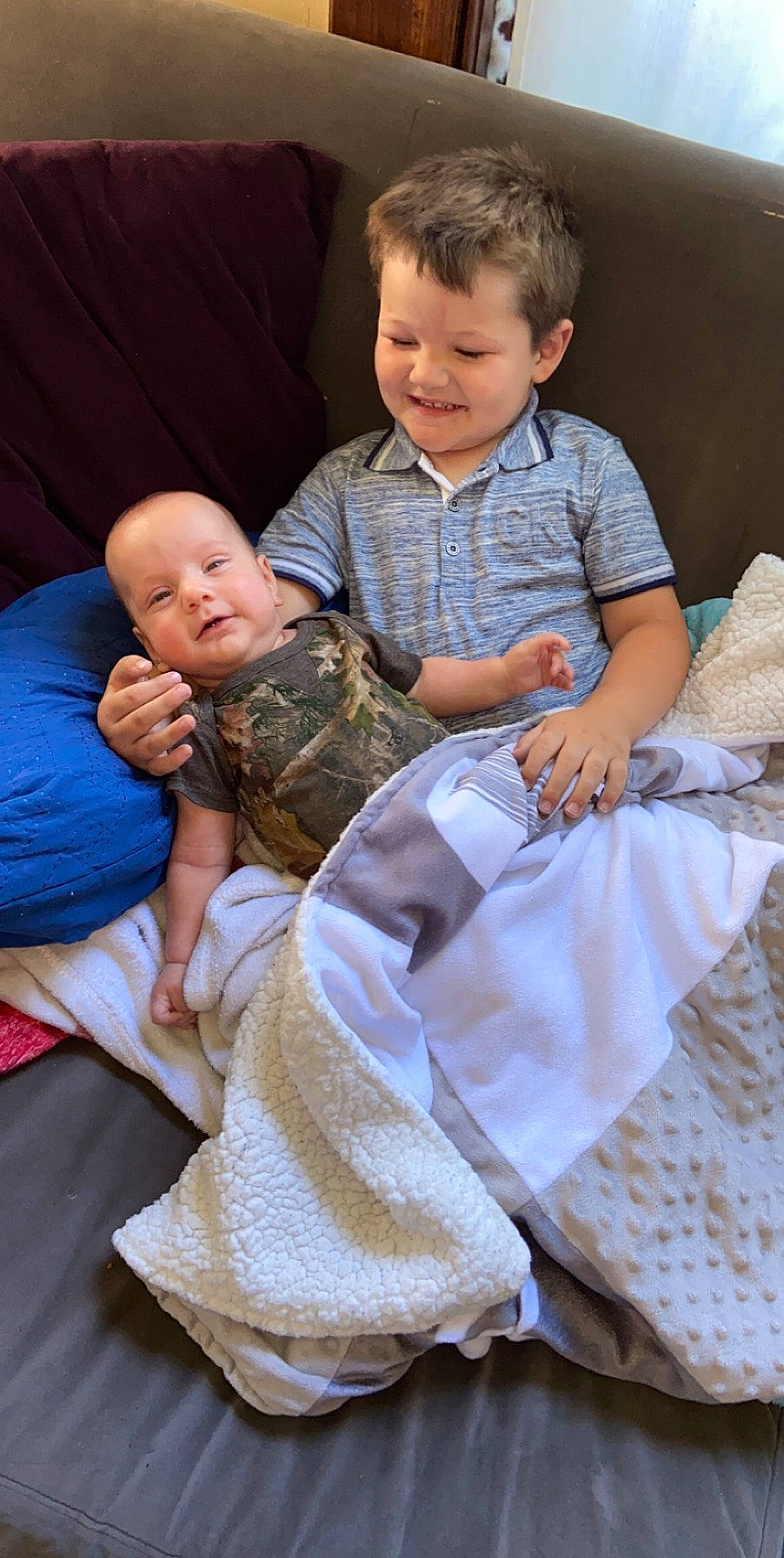 Bentley is registered to the contest to win money with this photo: baby, child, comfort, joy, person, sibling, sitting, toddler