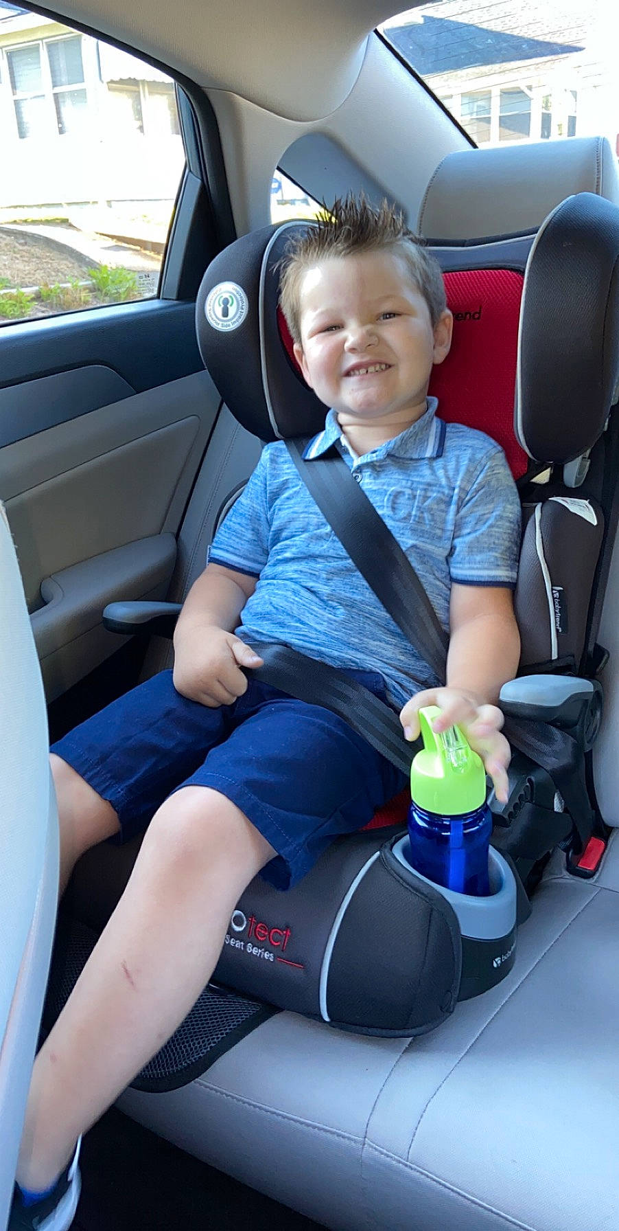 Bentley is registered to the contest to win money with this photo: auto_part, baby_in_car_seat, car, car_seat, car_seat_cover, child, city_car, family_car, head_restraint, joy, person, seat_belt, subcompact_car, vehicle