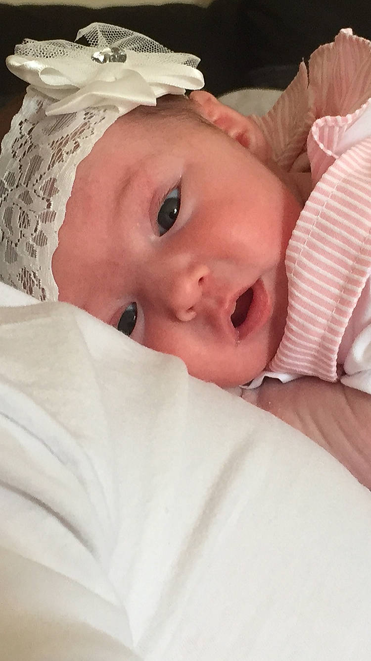 Dolly is registered to the contest to win money with this photo: baby, cheek, child, eye, face, head, headgear, lip, mouth, nose, person, skin, toddler