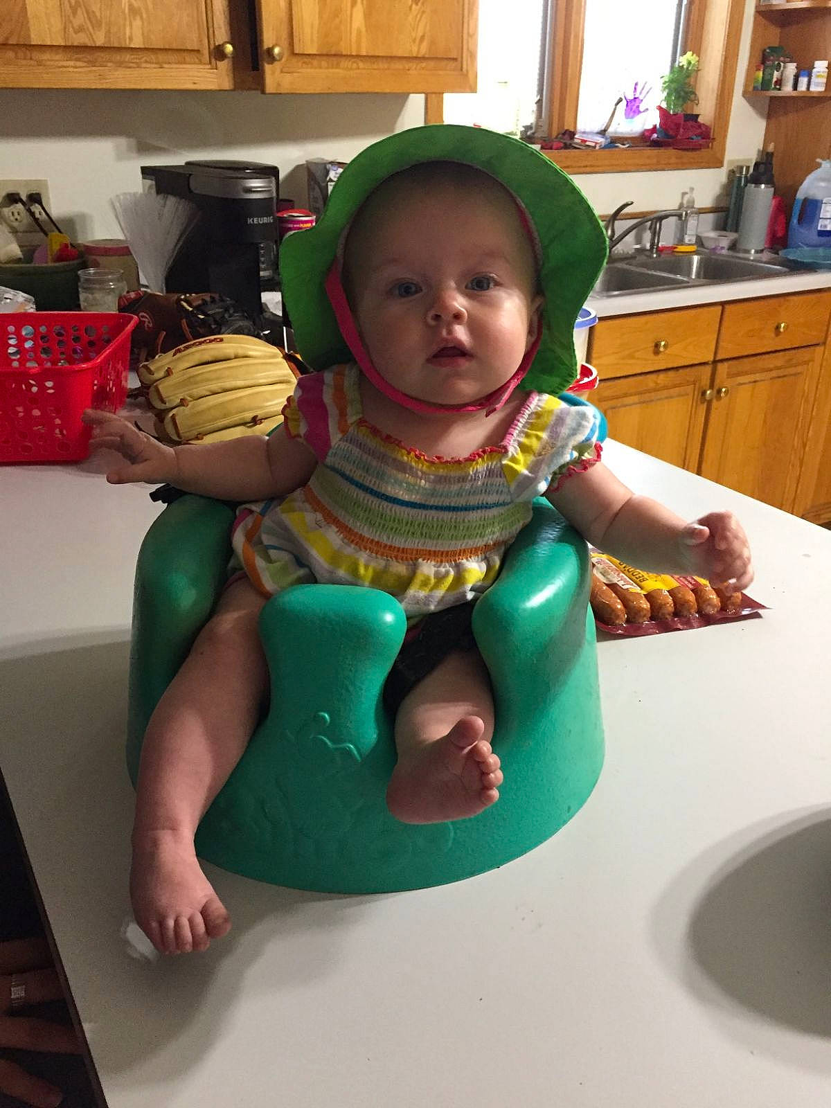 Sapheara is registered to the contest to win money with this photo: baby, baby_toddler_clothing, box, cabinetry, chair, child, cupboard, flooring, fun, houseplant, leisure, person, personal_protective_equipment, plastic, play, room, sitting, t_shirt, toddler, vacation