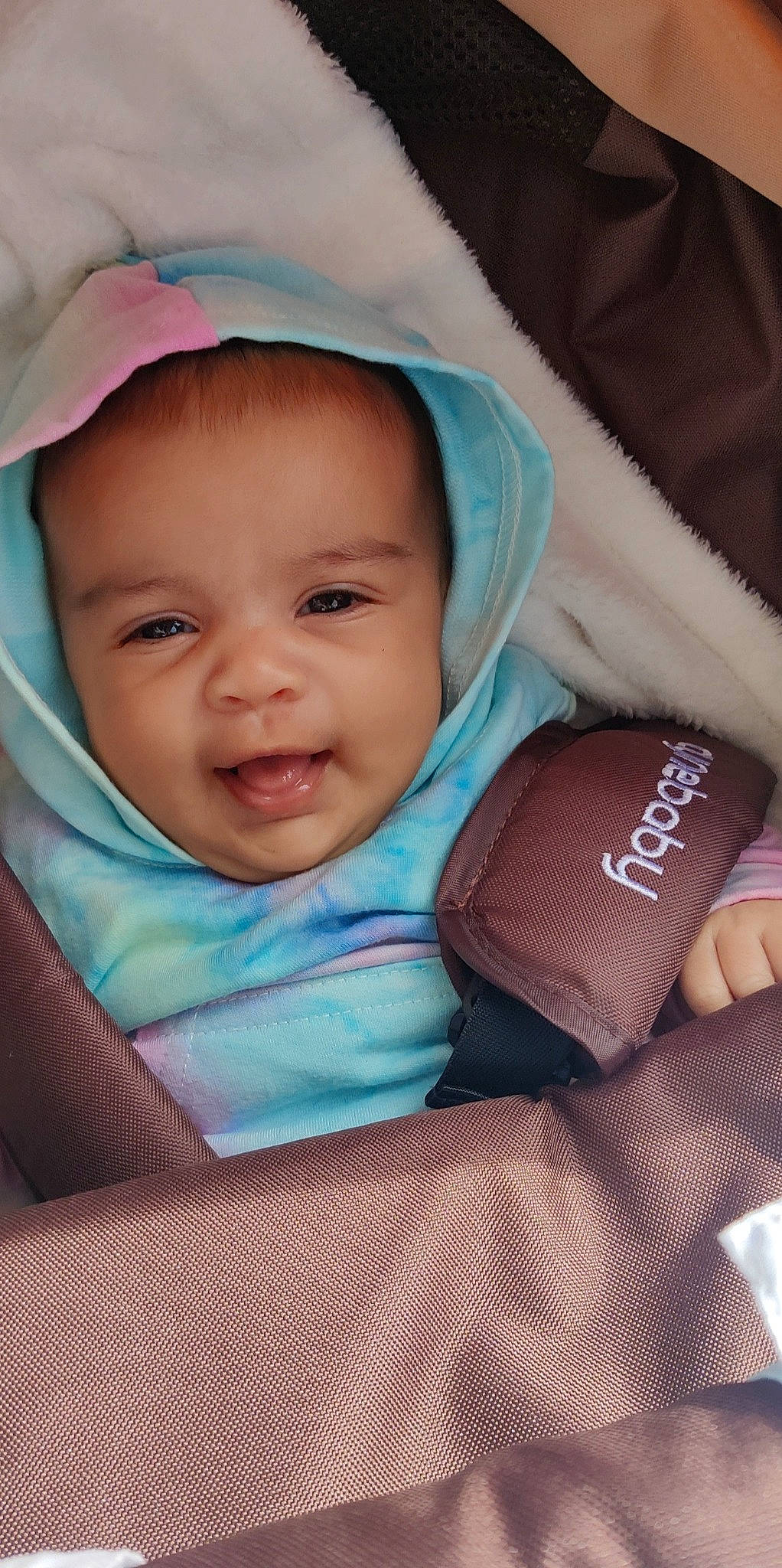 Celina is registered to the contest to win money with this photo: baby, baby_toddler_clothing, beauty, cheek, comfort, eye, eyebrow, face, facial_expression, finger, happy, iris, lip, outerwear, person, pink, product, skin, smile, textile