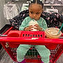 baby, beverage, child, clothing, cup, disposablecup, eating, face, female, food, footwear, girl, head, laundry, milk, person, photography, portrait, shoe, sitting