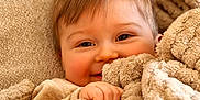 Matteo participe au concours pour gagner de l'argent avec cette photo : baby, blanket, child, closeup, comfort, cozy, cuddly, cute, face, fuzzy, hand, happy, indoors, person, portrait, resting, smiling, soft_texture, warm, young_child