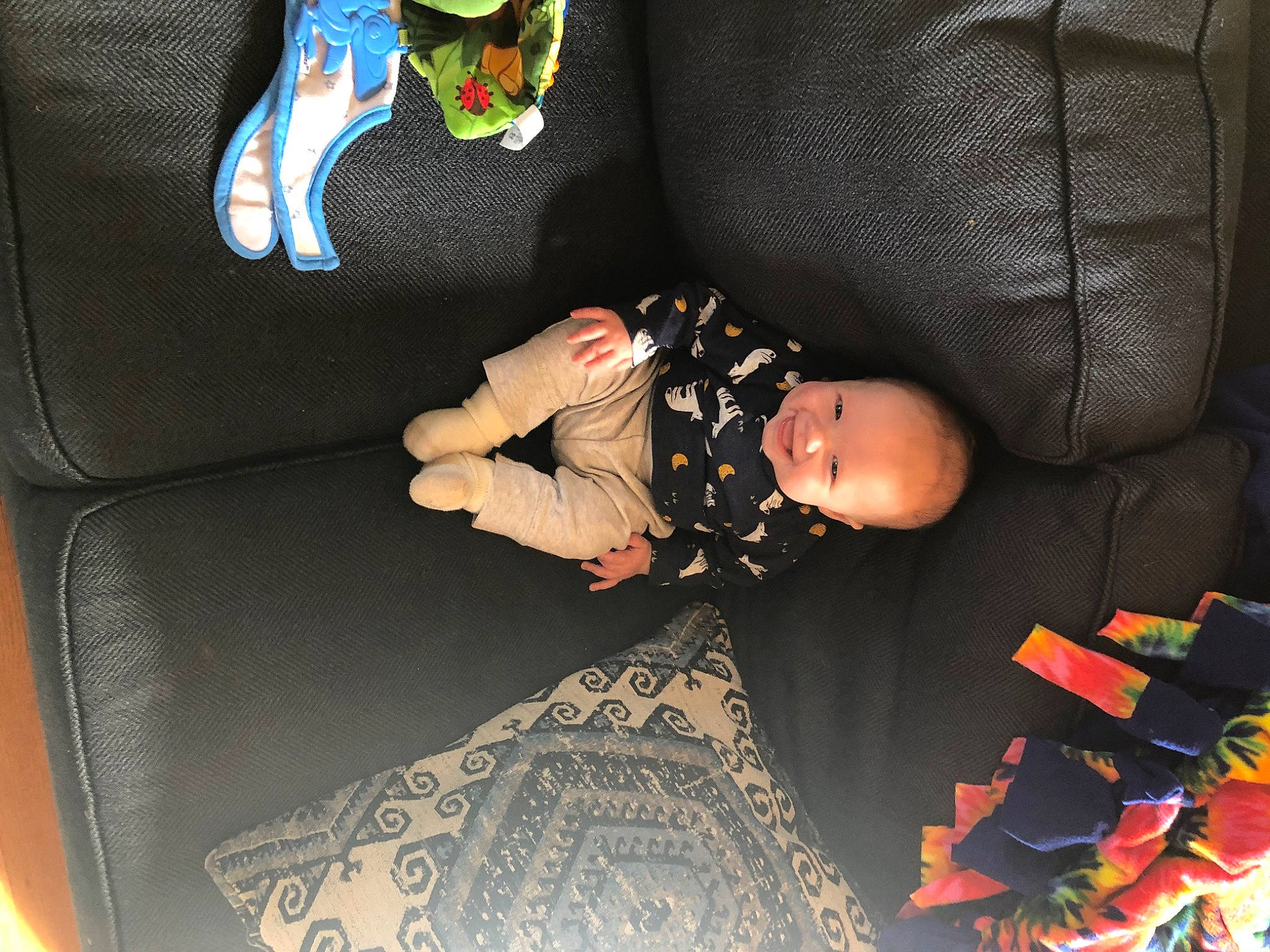 Bryson is registered to the contest to win money with this photo: baby, baby_products, baby_toddler_clothing, bag, black, car_seat, car_seat_cover, child, comfort, couch, dress, fun, green, joy, linens, pattern, person, room, sitting, sleeve