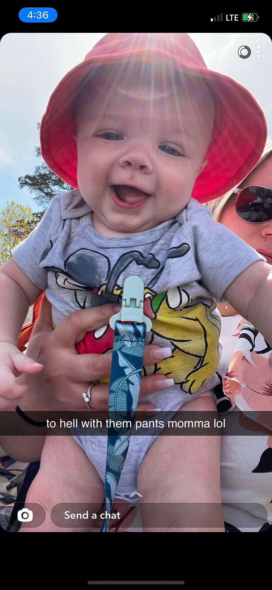 Bryson is registered to the contest to win money with this photo: arm, baby, baby_toddler_clothing, blue, cool, finger, gesture, hand, happy, hat, human, mouth, organ, person, photograph, pink, skin, sky, smile, thumb