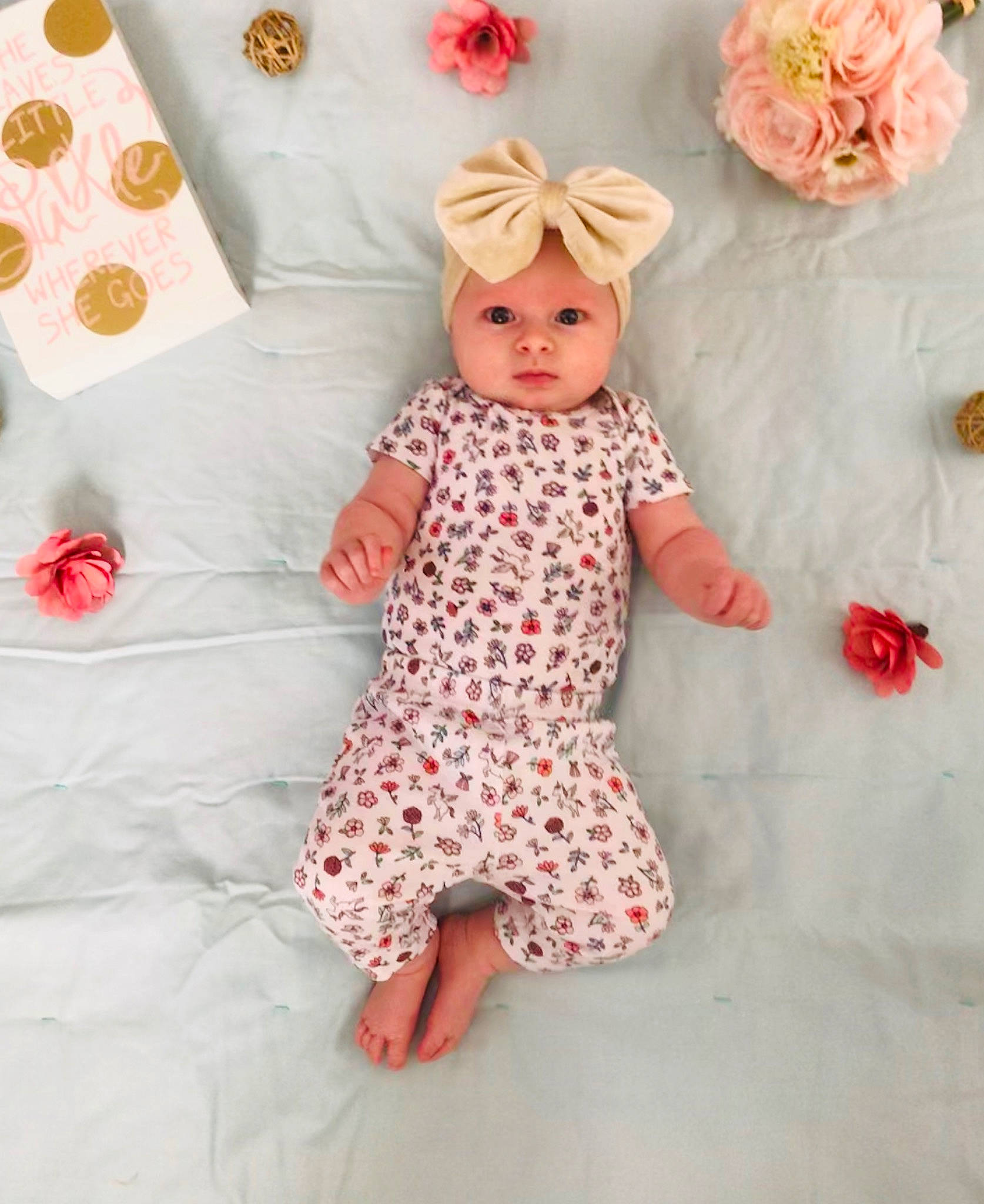 Aleah is registered to the contest to win money with this photo: baby, baby_toddler_clothing, child, clothing, design, dress, headwear, nightwear, pajamas, pattern, peach, person, pink, polka_dot, product, ruffle, sleeve, textile, toddler, toy