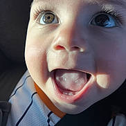 Thiago René Olvera joined the competition — help win amazing prizes! toddler, child, face, smiling, happy, eyes, mouth, car_seat, seat_belt, clothing, sporty, closeup, portrait, baby, expression, skin, light, shadow, indoors, person