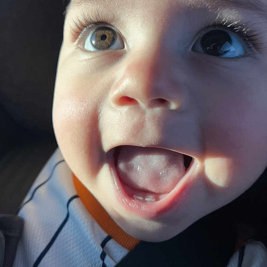 Thiago René Olvera joined the competition — help win amazing prizes! toddler, child, face, smiling, happy, eyes, mouth, car_seat, seat_belt, clothing, sporty, closeup, portrait, baby, expression, skin, light, shadow, indoors, person