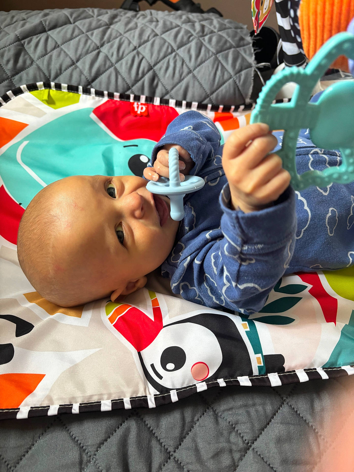 Adonis is registered to the contest to win money with this photo: baby, bed, blanket, bodypart, couch, crib, cushion, cutlery, face, finger, furniture, hand, head, homedecor, infantbed, person, photography, portrait, quilt, spoon