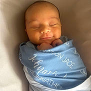 Johnathon joined the competition — help win amazing prizes! newborn, baby, infant, swaddle, sleeping, smiling, face, peaceful, blue, blanket, portrait, cute, soft, resting, child, human, cozy, wrapped, newborn_baby, indoors