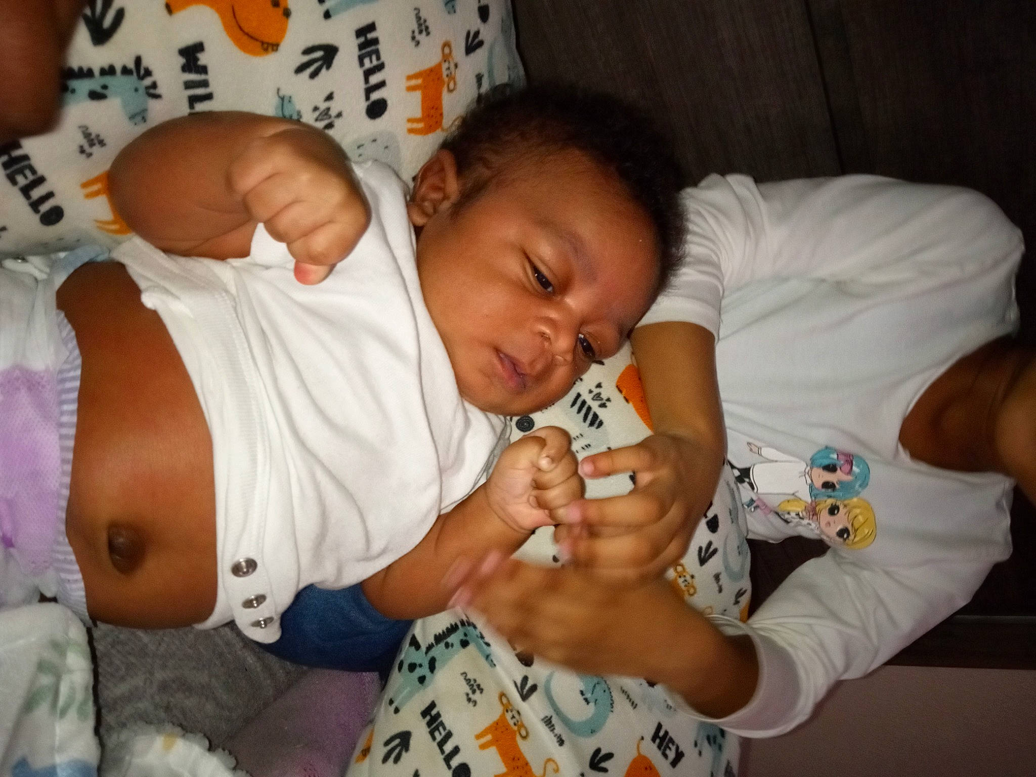 John is registered to the contest to win money with this photo: abdomen, arm, baby, baby_products, baby_toddler_clothing, bedtime, cheek, child, comfort, face, finger, gesture, hand, happy, human, mouth, nose, person, skin, thumb