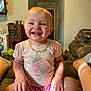 Oaklynn joined the competition — help win amazing prizes! toddler, child, smiling, indoor, pink_shirt, ladybug, necklace, happy, sitting, living_room, sofa, couch, person, short_hair, cute, baby, home, furniture, feet, legs